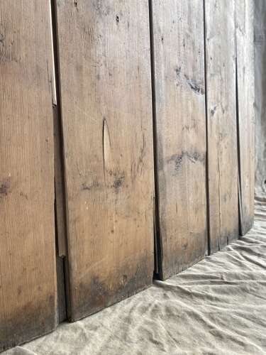 An antique 19th century pine barrel back settle