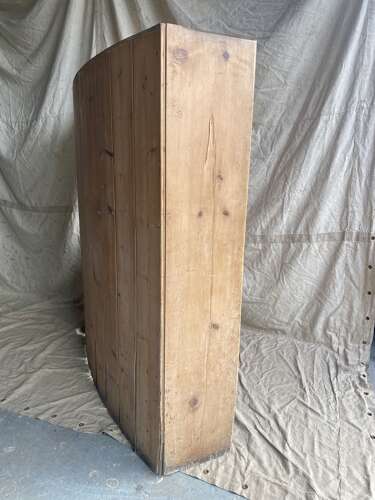 An antique 19th century pine barrel back settle