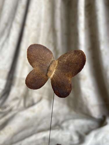 An antique clockwork musical toleware fabric flower and butterfly automaton