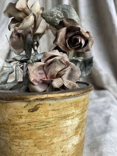 An antique clockwork musical toleware fabric flower and butterfly automaton