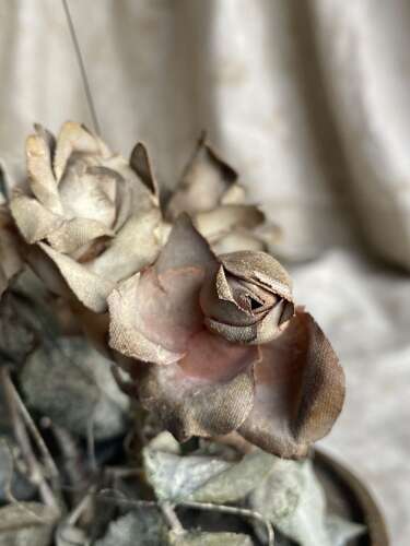 An antique clockwork musical toleware fabric flower and butterfly automaton