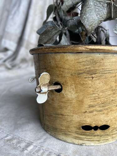 An antique clockwork musical toleware fabric flower and butterfly automaton