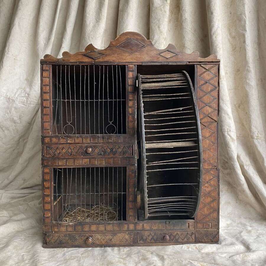A Victorian naive antique folk art squirrel cage