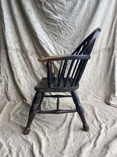 A mid 19th century antique Lincolnshire low stick back Windsor armchair