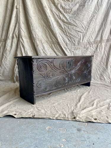 An English antique 17th century six plank oak boarded chest dated 1677