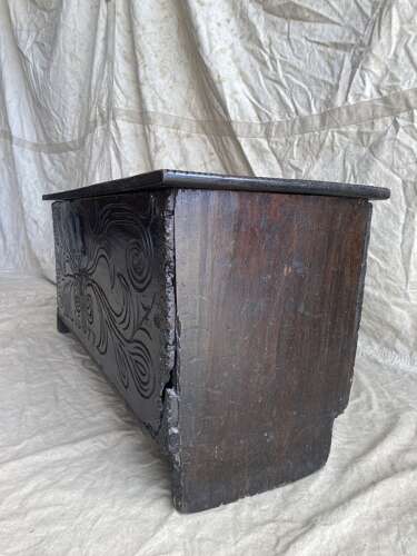 An English antique 17th century six plank oak boarded chest dated 1677