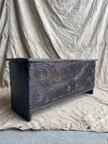 An English antique 17th century six plank oak boarded chest dated 1677