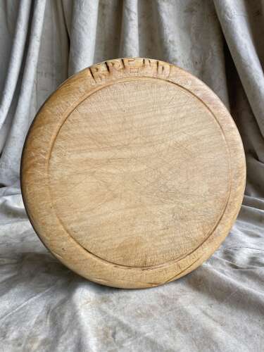 An antique English carved early 20th century sycamore breadboard