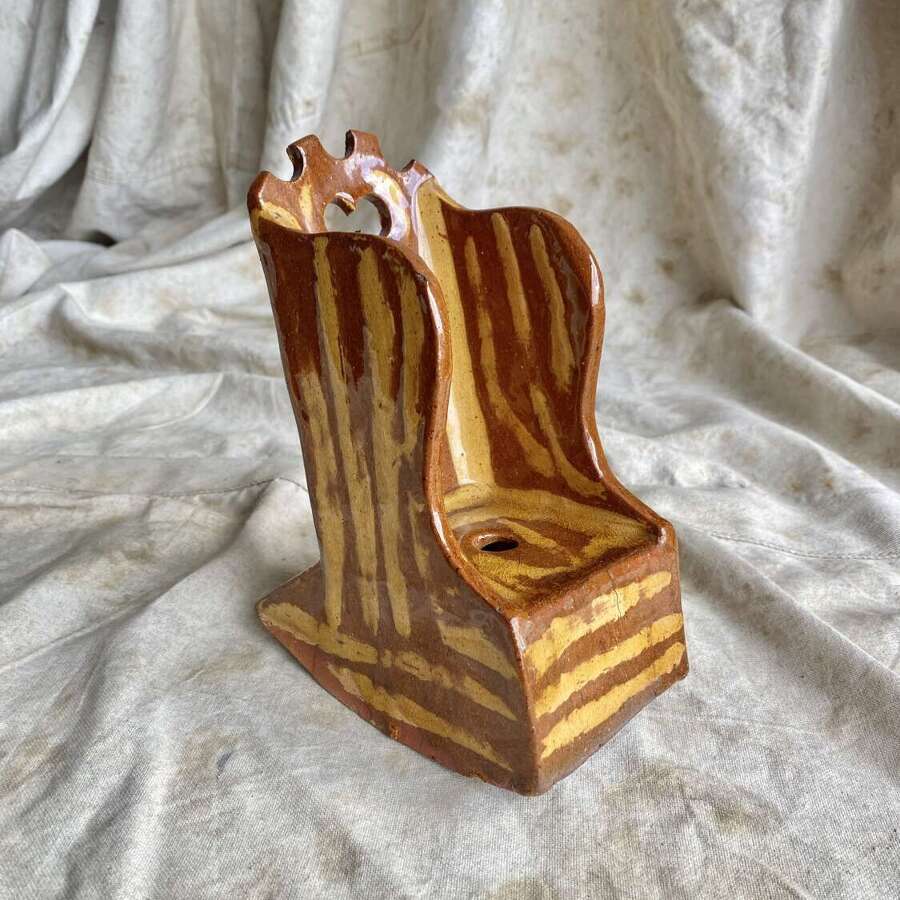 A 19th century antique Yorkshire folk art slipware pottery model of a lambing chair