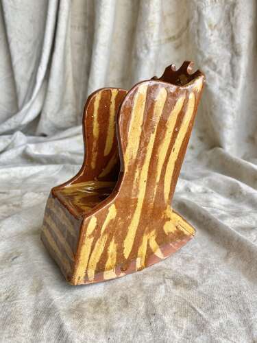 A 19th century antique Yorkshire folk art slipware pottery model of a lambing chair