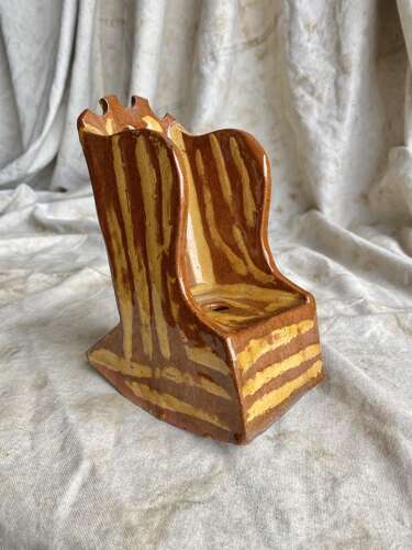 A 19th century antique Yorkshire folk art slipware pottery model of a lambing chair