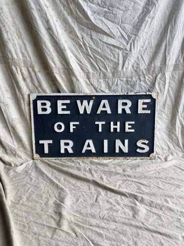 An antique cast iron railway sign
