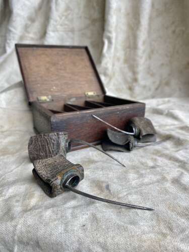 A rare cased set of antique early 19th century cock fighting spurs