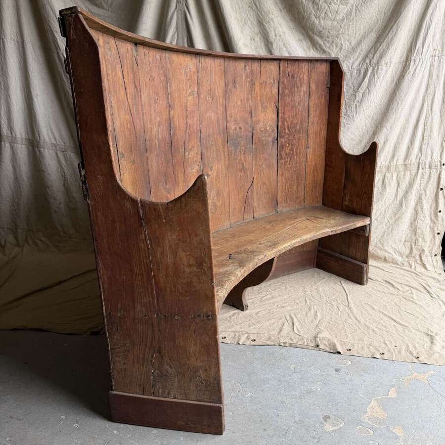 A late 18th century English antique elm and pine barrel back settle