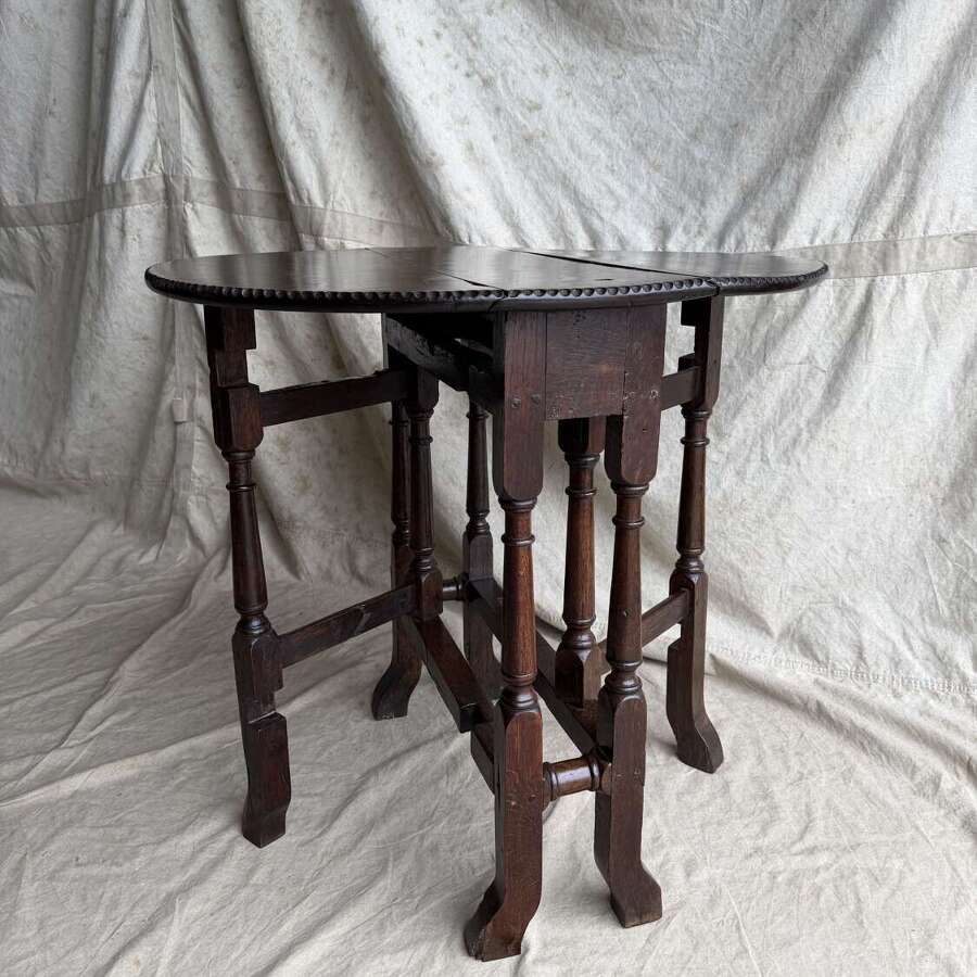 A small antique early 18th century oak gateleg table