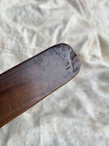 An antique early 19th century folk art fruitwood knitting sheath with apotropaic symbol