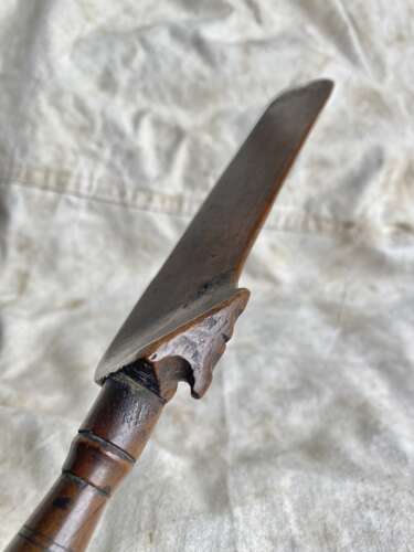 An antique early 19th century folk art fruitwood knitting sheath with apotropaic symbol