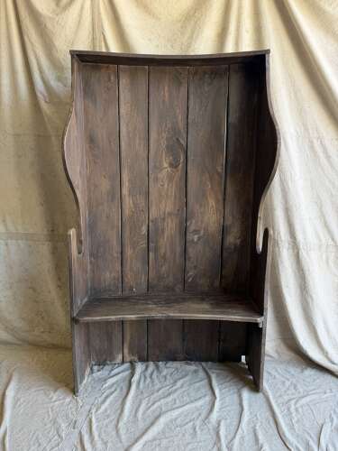 A diminutive 18th century all elm antique barrel back tavern settle