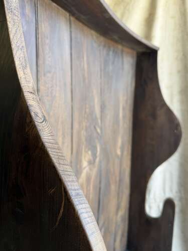 A diminutive 18th century all elm antique barrel back tavern settle