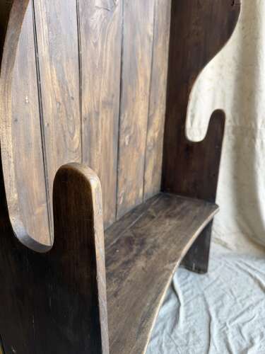 A diminutive 18th century all elm antique barrel back tavern settle