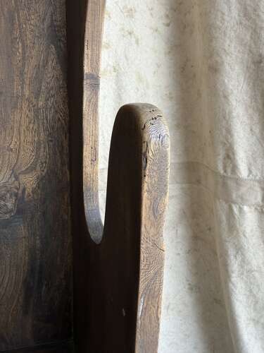 A diminutive 18th century all elm antique barrel back tavern settle