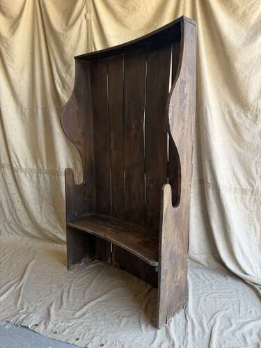 A diminutive 18th century all elm antique barrel back tavern settle