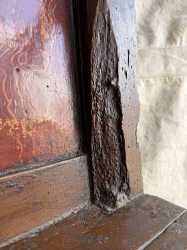 A Georgian Welsh antique elm and pine settle in original painted finish