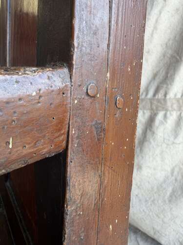 A Georgian Welsh antique elm and pine settle in original painted finish