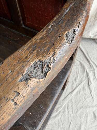 A Georgian Welsh antique elm and pine settle in original painted finish
