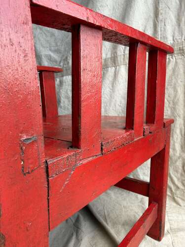 A 19th century antique painted pine Irish vernacular deep seat armchair