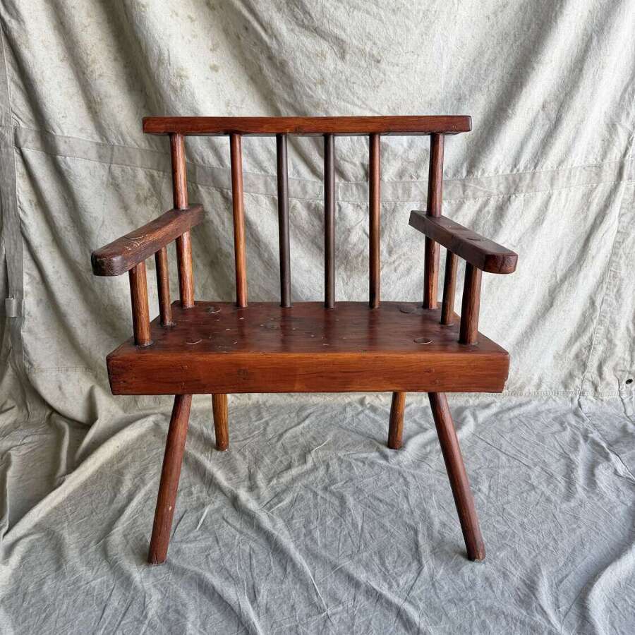 A rustic 1940s Irish vernacular pine famine hedge row chair