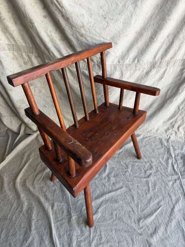 A rustic 1940s Irish vernacular pine famine hedge row chair