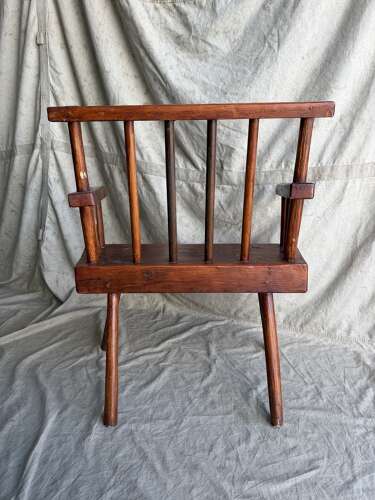 A rustic 1940s Irish vernacular pine famine hedge row chair