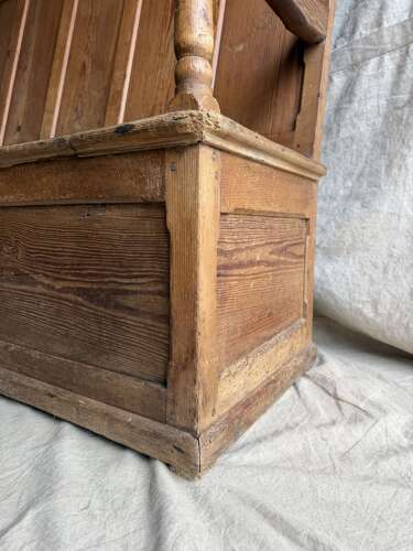 A Welsh antique 19th century pitch pine box settle