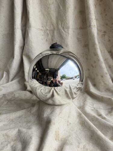 A large antique 19th century mercury glass witch ball