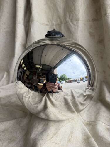 A large antique 19th century mercury glass witch ball