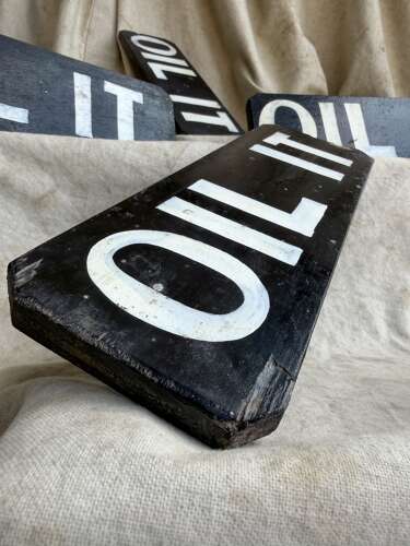 A 1920s antique hand painted wooden workshop oil it sign