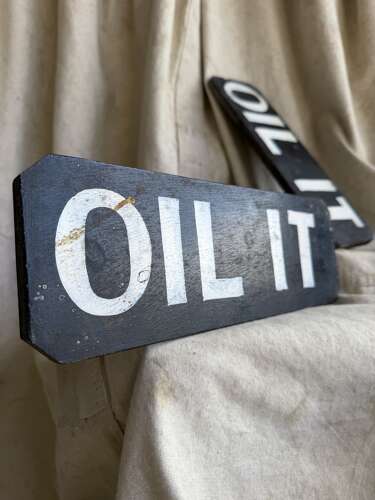 A 1920s antique hand painted wooden workshop oil it sign