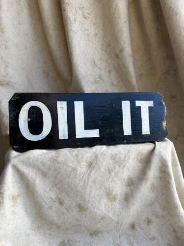 A 1920s antique hand painted wooden workshop oil it sign