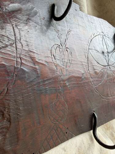 A rare 17th century antique apotropaic folk art carved pine game rack