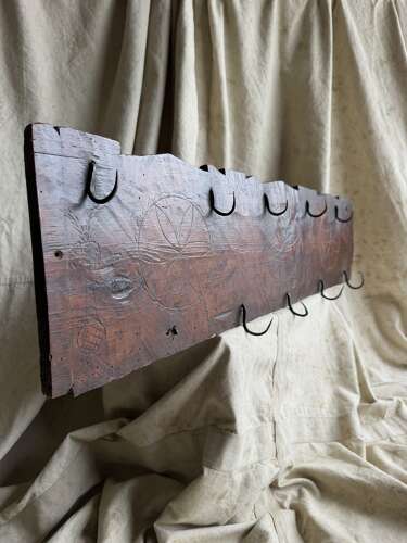 A rare 17th century antique apotropaic folk art carved pine game rack