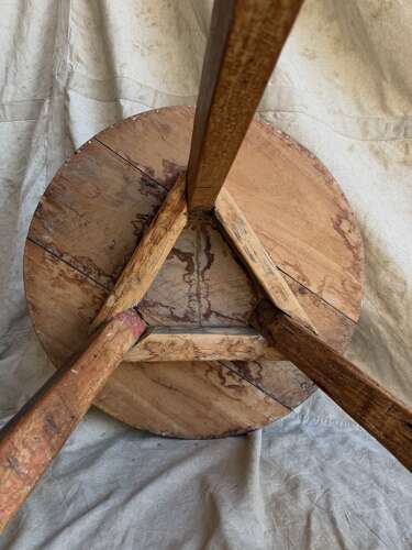 An antique Irish late 19th century elm cricket table